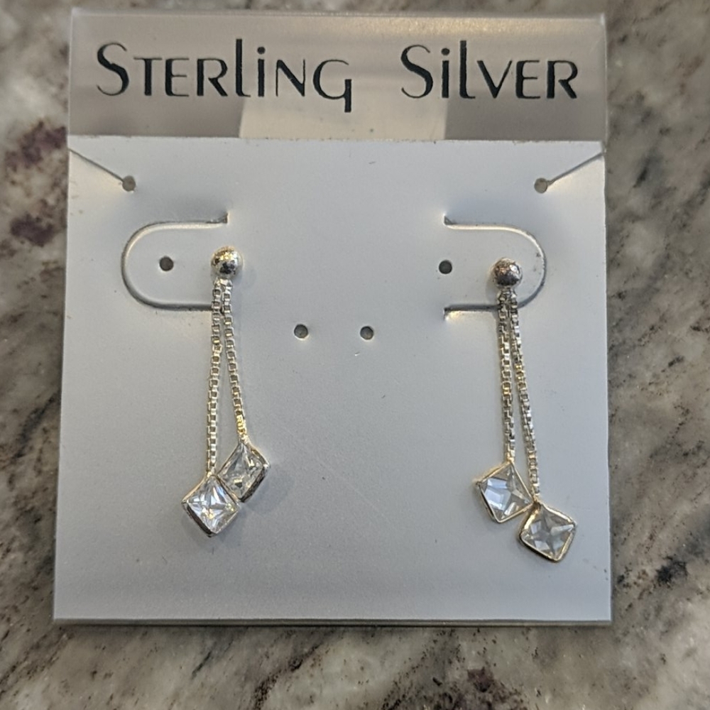 Sterling silver and cubic zirconia drop earrings.